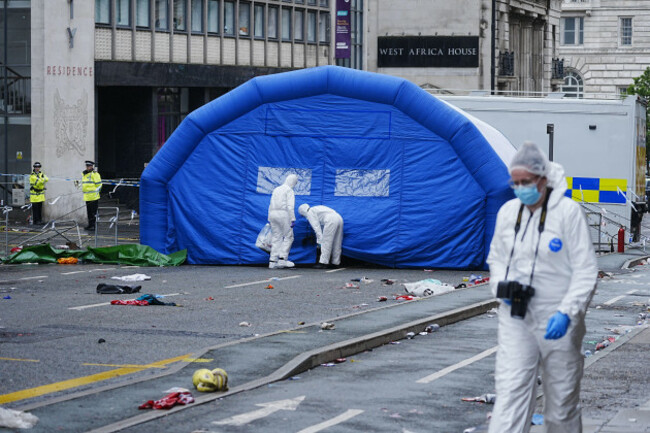 forensic-officers-walk-past-an-inflatable-field-tent-at-the-scene-in-water-street-near-the-liver-building-in-liverpool-after-a-53-year-old-white-british-man-was-arrested-when-a-car-ploughed-into-a-cro